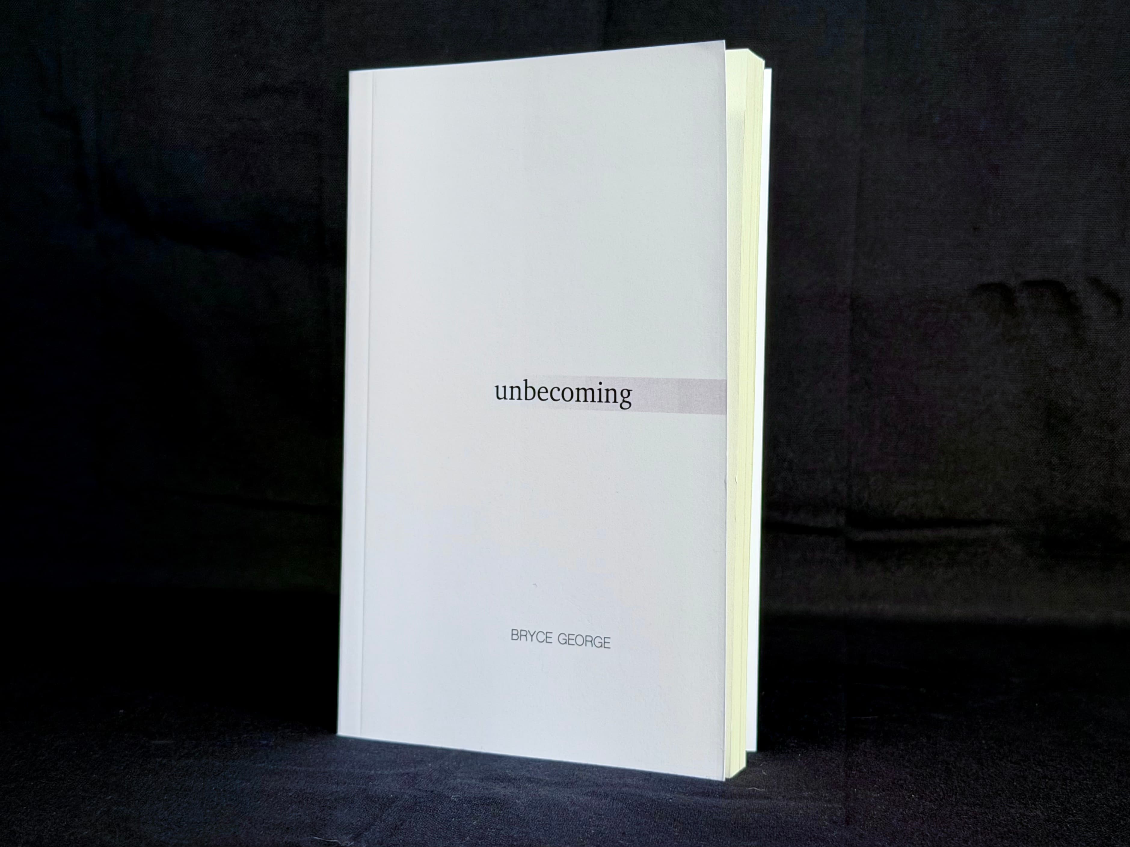 A standing copy of Unbecoming by Bryce George.
